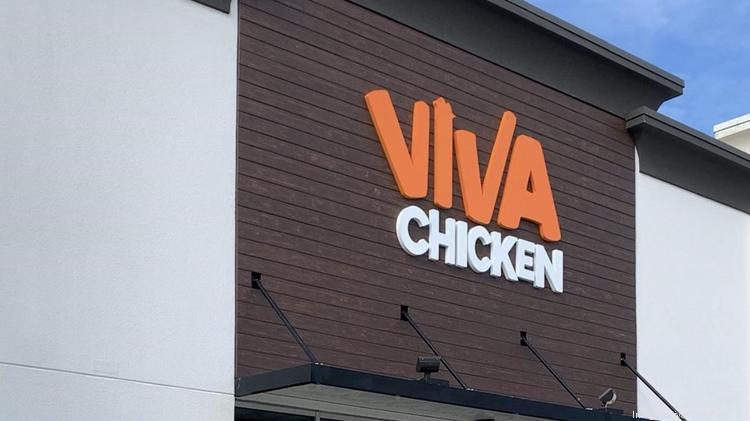 The exterior of a restaurant with a brown and white facade displays the sign 